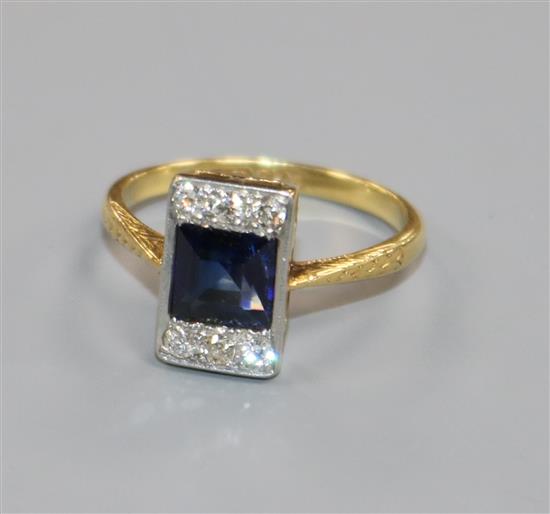 An 18ct gold and platinum, synthetic sapphire and diamond tablet ring, size P/Q.